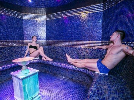 couple in aromatic steam room